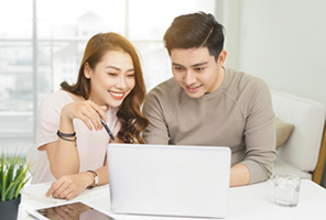 Couple browsing on the laptop